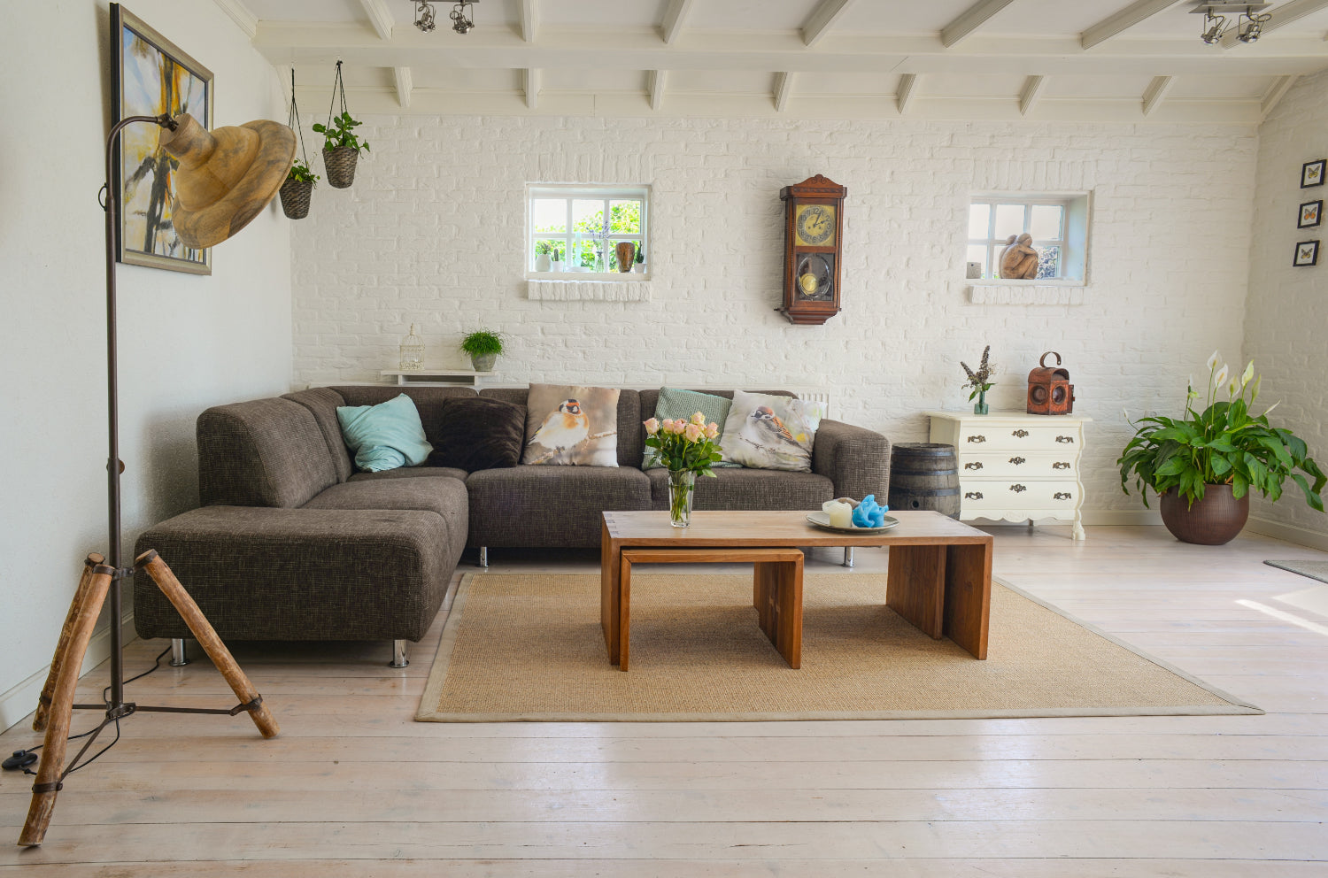 Cozy living room with a sectional sofa, coffee table, and wall decor